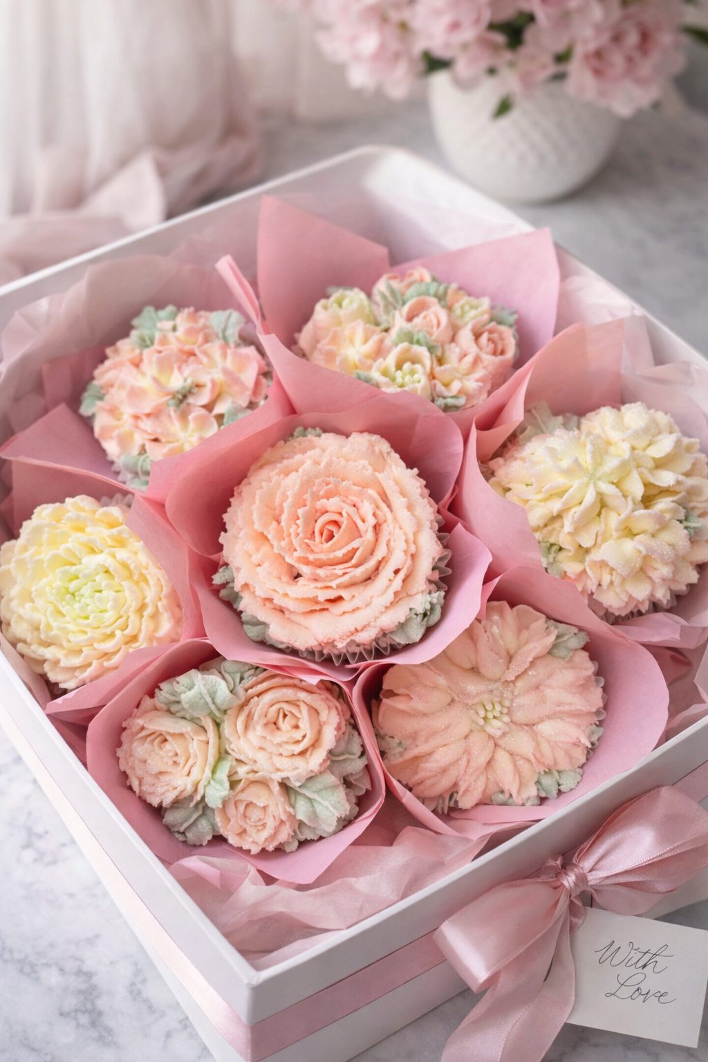 Mother's Day bouquet of seven floral cupcakes in pink wrapping
